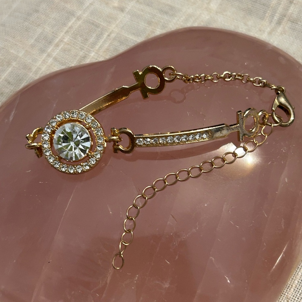 Gold and cubic zirconia focal stone with smaller cz’s each side. - Picture 9 of 9